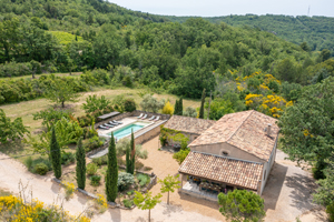 Aerial view of Villa Lumière des Cerisiers near Apt with private heated pool, terraces and cherry-lined driveway in the Luberon valley.