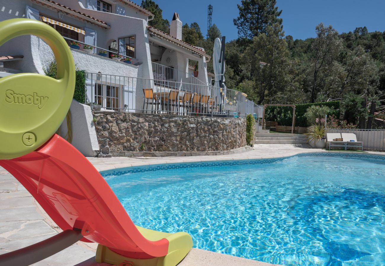 Villa Bellevue featuring a heated pool and a children's slide for joyful family moments